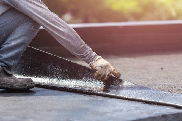 Professional Waterproofing technician working in Free Soil, MI